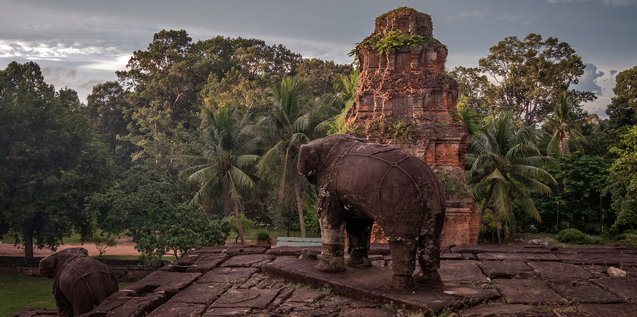  2m high standing stone elephants at corners of the first and second tiers in East Mebon.