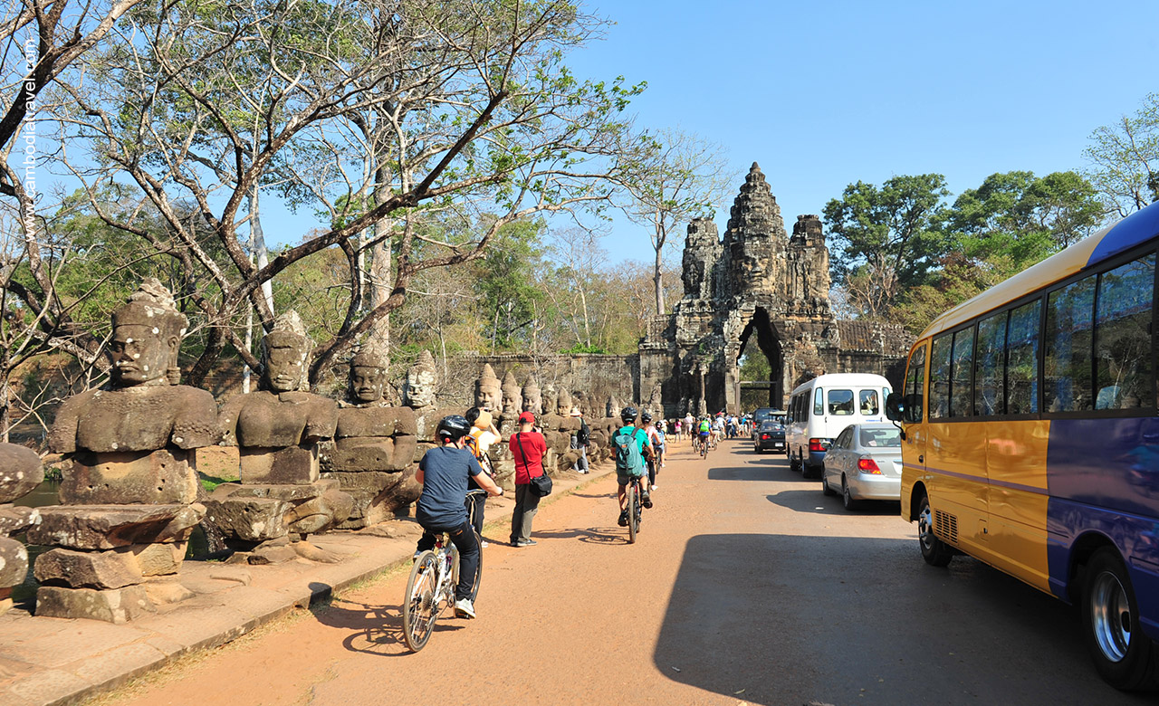 Victory Gate in Angkor Thom is always busy with many tour buses and other vehicles.