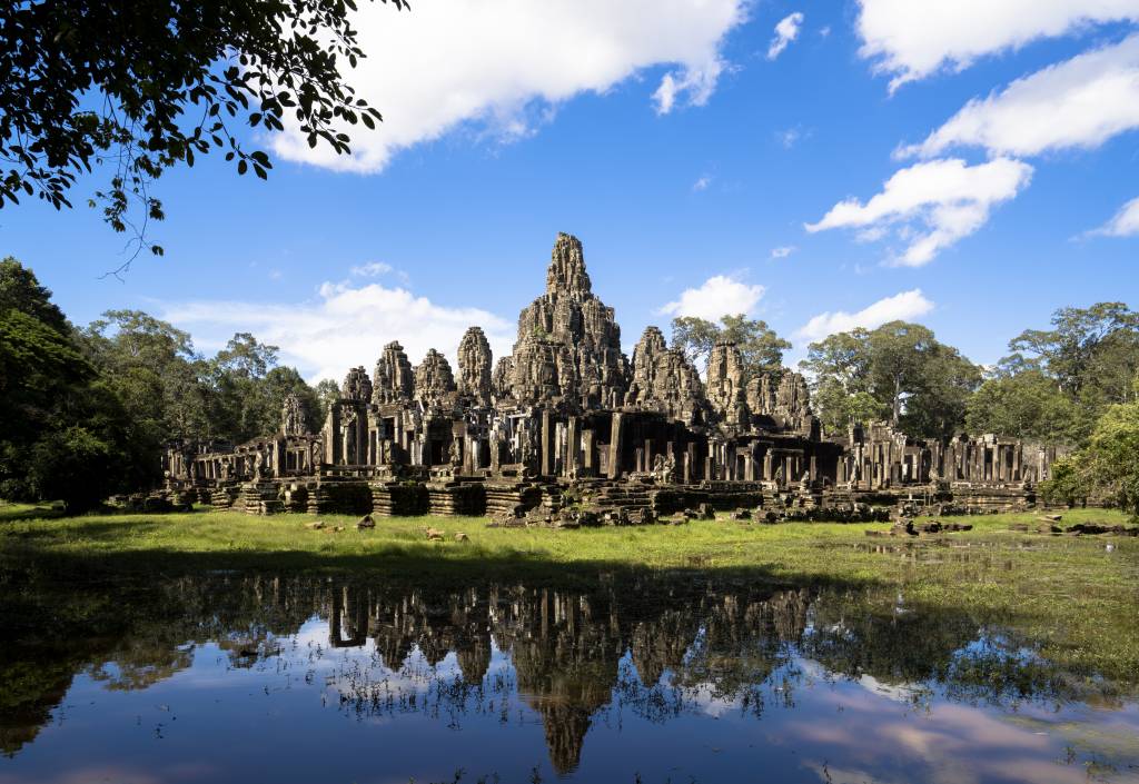 A panoramic view of Bayon Temple, showing its unique stone towers and detailed carvings.